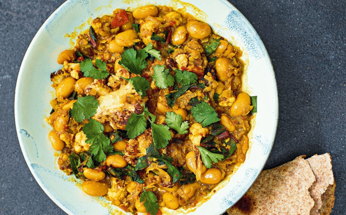 cauliflower butter bean & chard dahl with ginger and curry spices