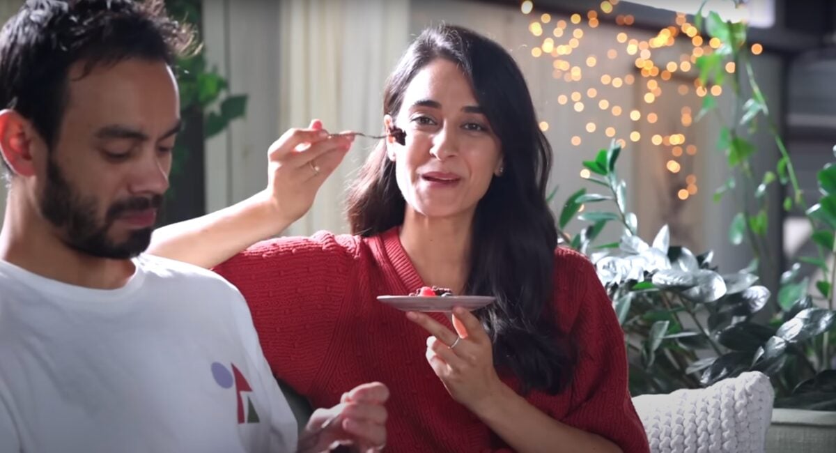 Sadia Badiei from Pick Up Limes enjoying a rich, fudgy, egg-free, and dairy-free vegan brownie 